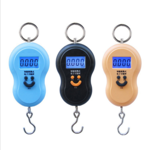 A user-friendly fishing scale with a cheerful smiley face design for accurate and enjoyable fishing adventures.